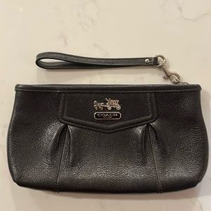 Coach, black wristlet with purple interior